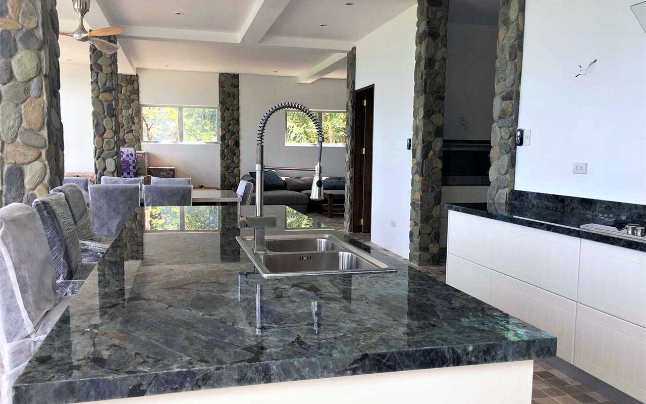 island kitchen with rare marble counter top